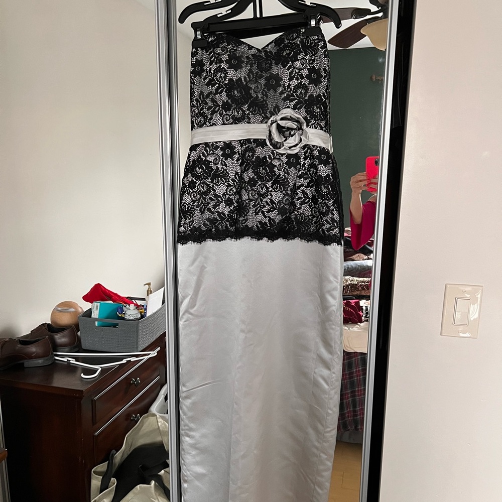 This is a size 10 fits more like a 6.  Never worn. Gray w/black lace